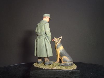 S2KW061 - Young German in greatcoat with German Shepherd